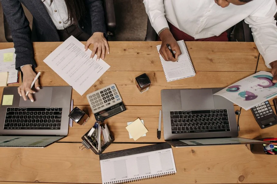 Designer editing a slide layout on a laptop screen